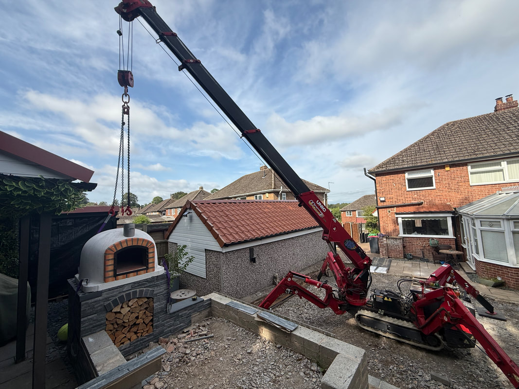 Pizza oven transport team in action